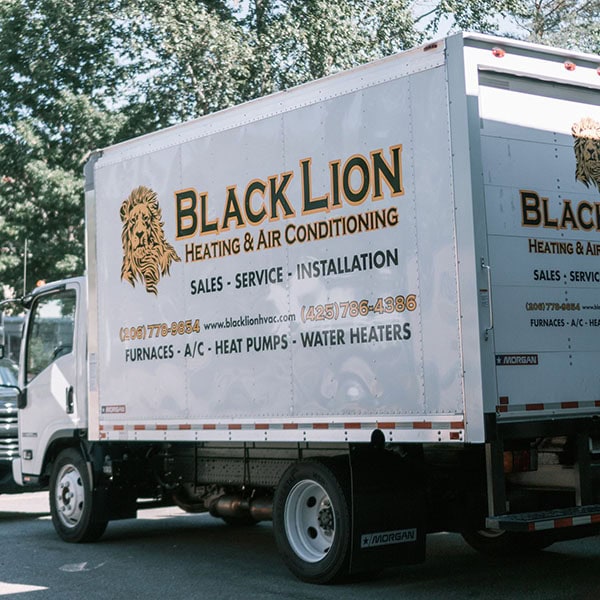 Black Lion HVAC branded truck in parking lot.