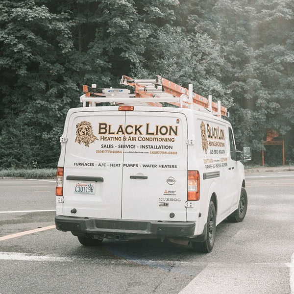 hvac truck driving out of a parking space.