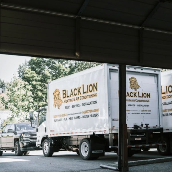 ev-charging-stations-1_600x600 Black Lion Heating, Air Conditioning, & Electrical company trucks in a parking lot.