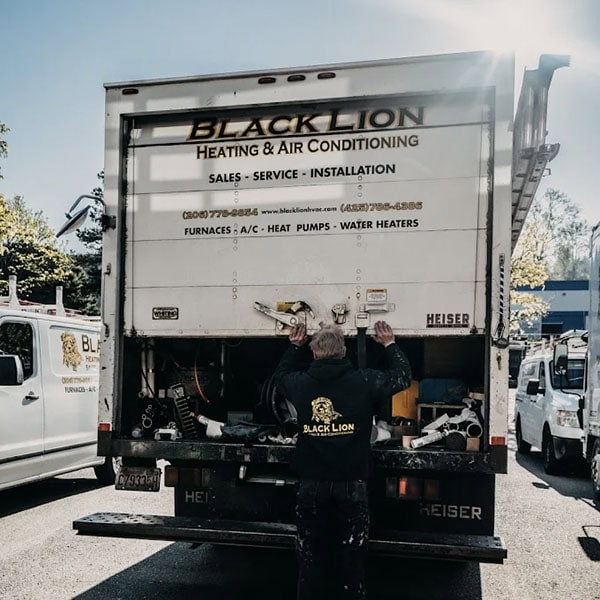 indoor-air-quality-1_600x600 Black Lion Heating, Air Conditioning, & Electrical technician closing the back of the company truck.