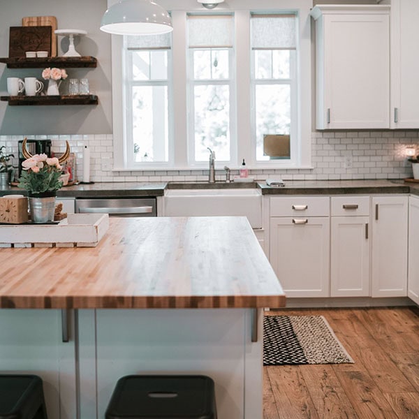 Inside of a house showing the kitchen.